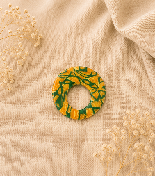Broche à lunette ronde marbrée vert jaune